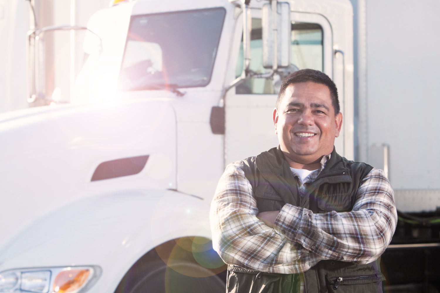 DOT exams photo with man standing by truck